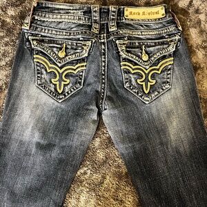 Rock Revival Men's Faded Blue Jeans with Yellow Embroidery